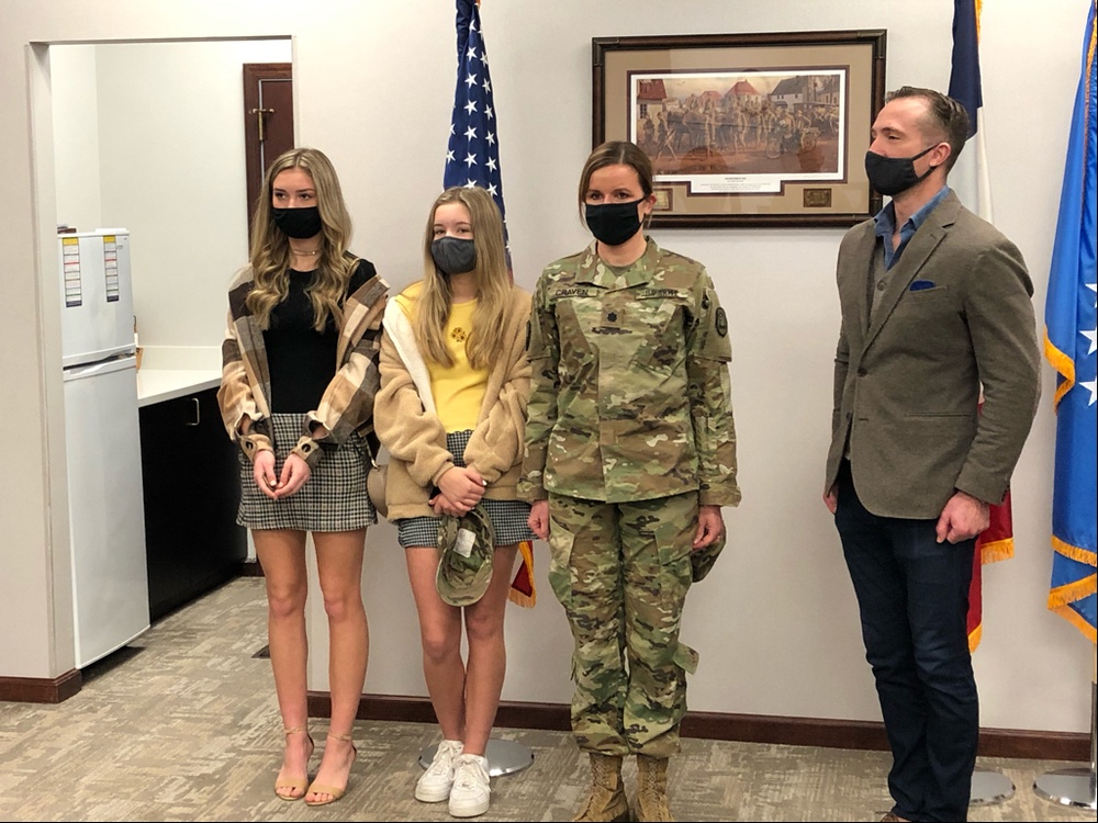 Col. Linda Craven, J3, Domestic Operations Officer, Iowa National Guard posses with her family after