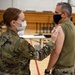 Airmen from the 621st Contingency Response Wing receive a COVID-19 vaccination