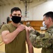Airmen from the 621st Contingency Response Wing receive a COVID-19 vaccination