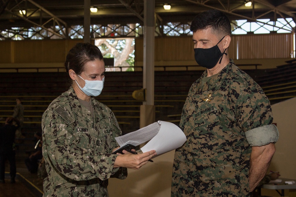 U.S. Marine Corps Brig. Gen. Mark Hashimoto receives his second dose of the COVID-19 vaccine