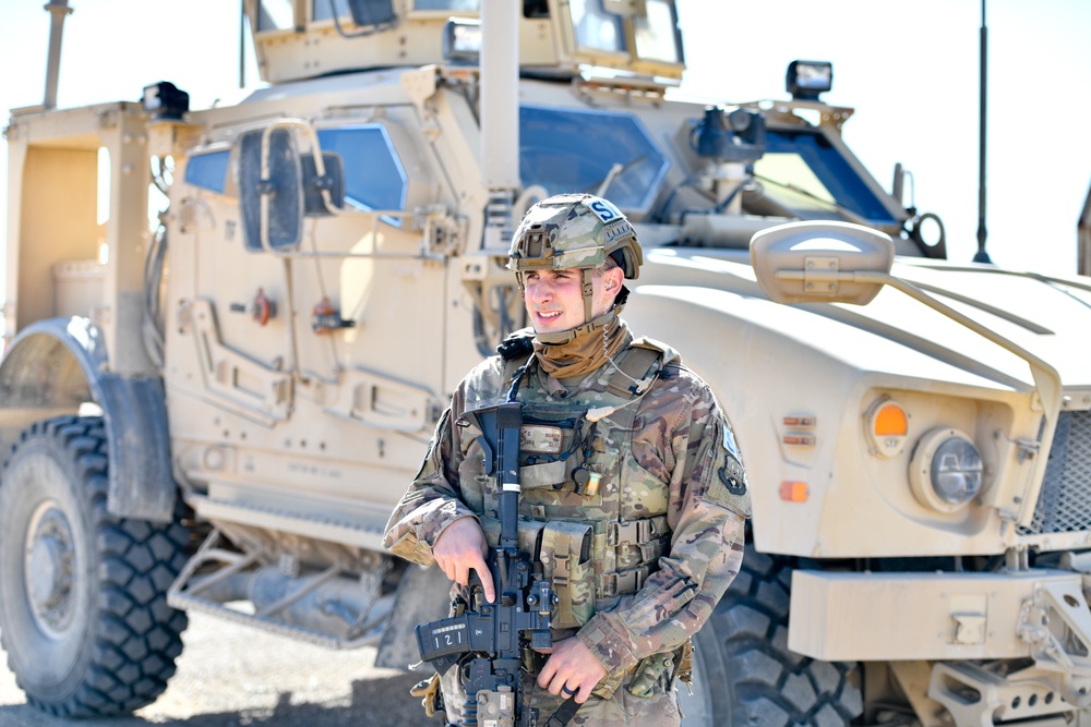 Members of the 332 Expeditionary Security Forces Squadron Sweep Perimeter Road