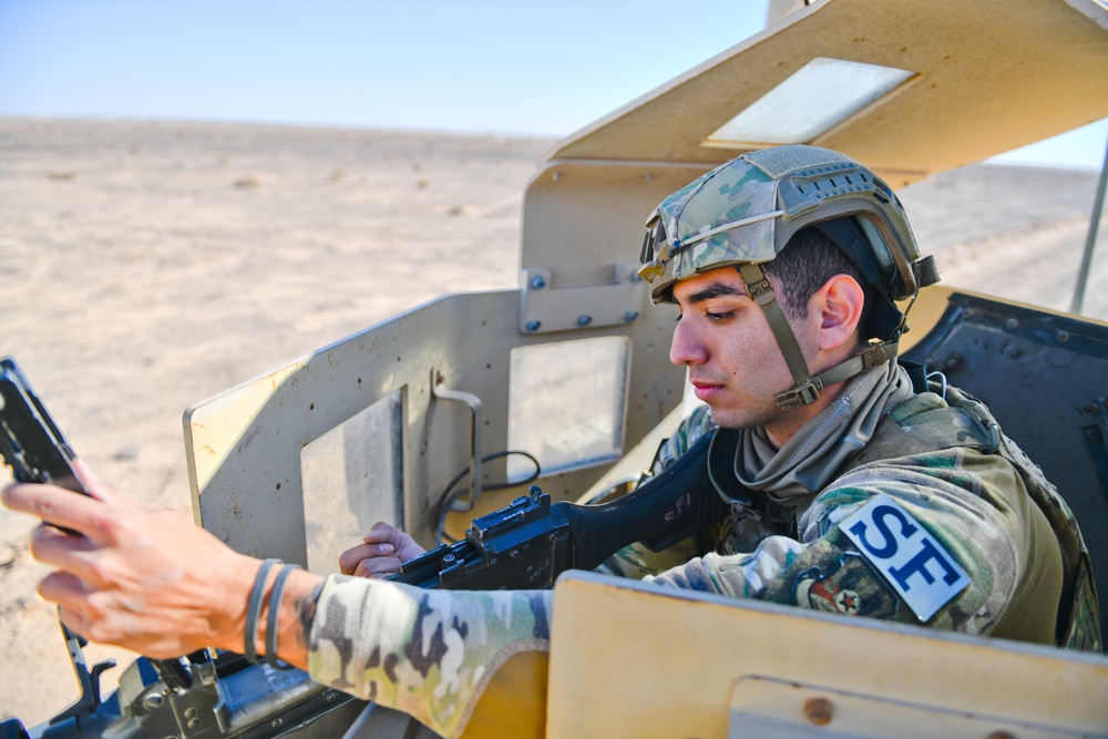 Members of the 332 Expeditionary Security Forces Squadron Sweep Perimeter Road