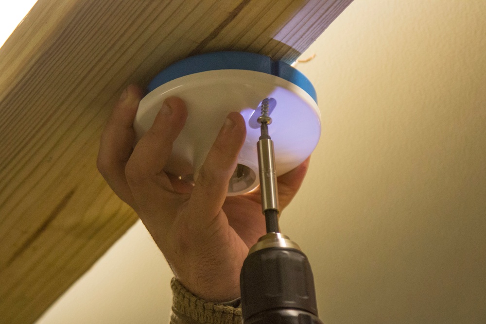 A Marine with Golf Co., 2MRSB, installs electrical wiring during TRXII