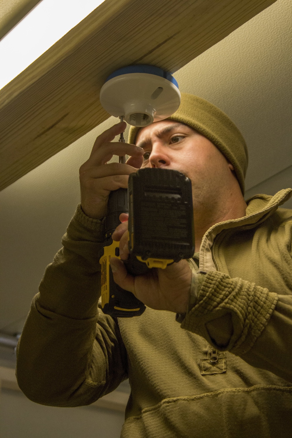 A Marine with Golf Co., 2MRSB, installs electrical wiring during TRXII