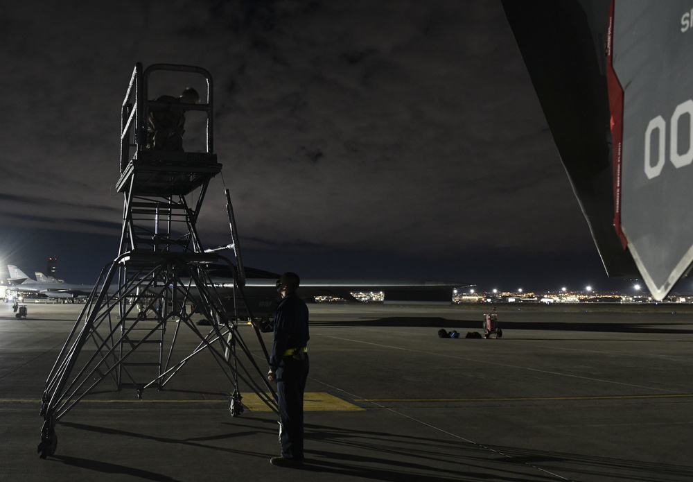 Preparing an aircraft stand for a post-flight inspection after a Red Flag 21-1 nighttime training mission