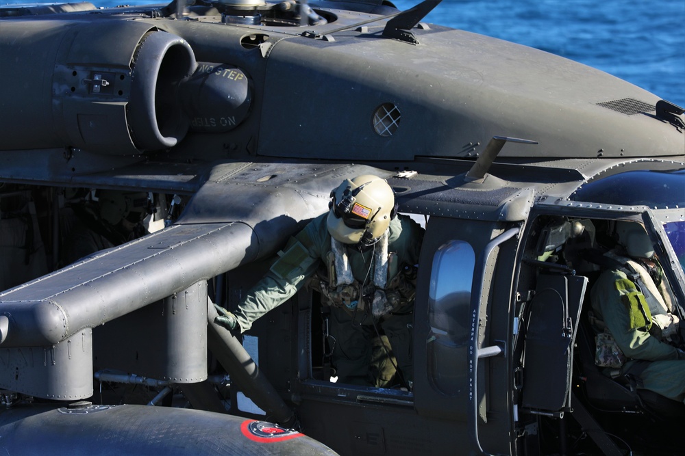 U.S. Army Aviation Battalion-Japan conducts deck landing qualifications with USS Benfold (DDG-65)