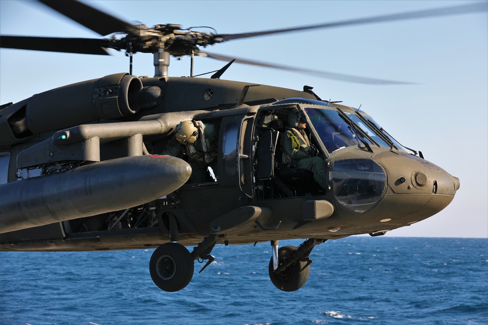 U.S. Army Aviation Battalion-Japan conducts deck landing qualifications with USS Benfold (DDG-65)