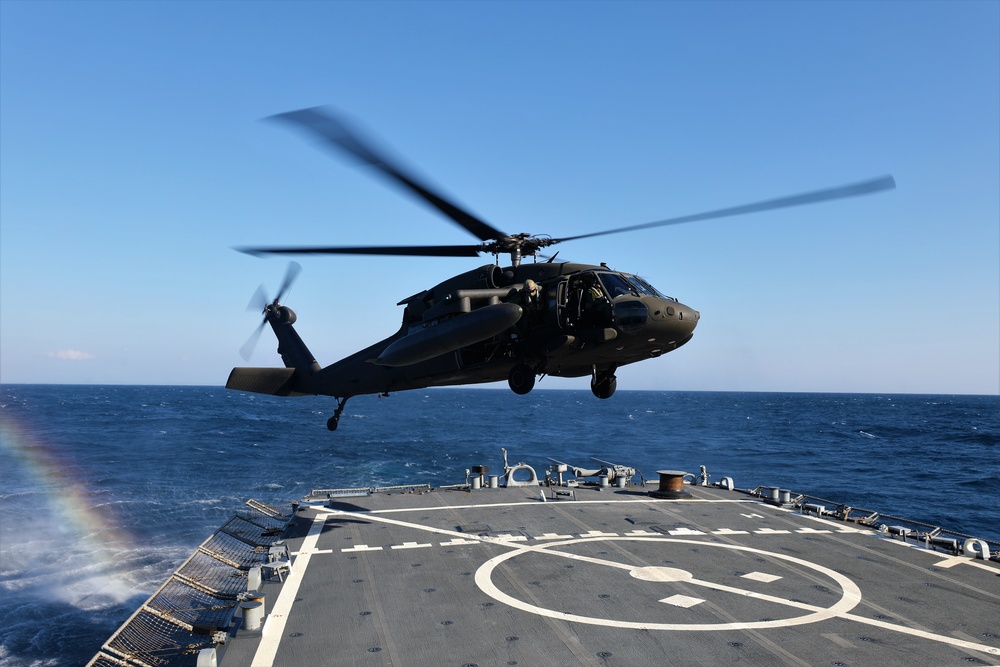 U.S. Army Aviation Battalion-Japan conducts deck landing qualifications with USS Benfold (DDG-65)