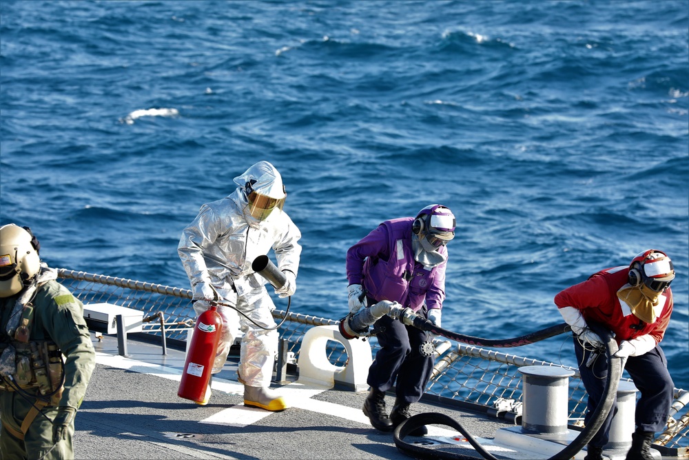 U.S. Army Aviation Battalion-Japan conducts deck landing qualifications with USS Benfold (DDG-65)