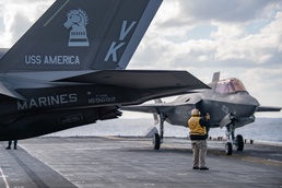 An F-35B Lightning II assigned to the 31st Marine Expeditionary Unit (MEU) lands on the flight deck of amphibious assault ship USS America (LHA 6)