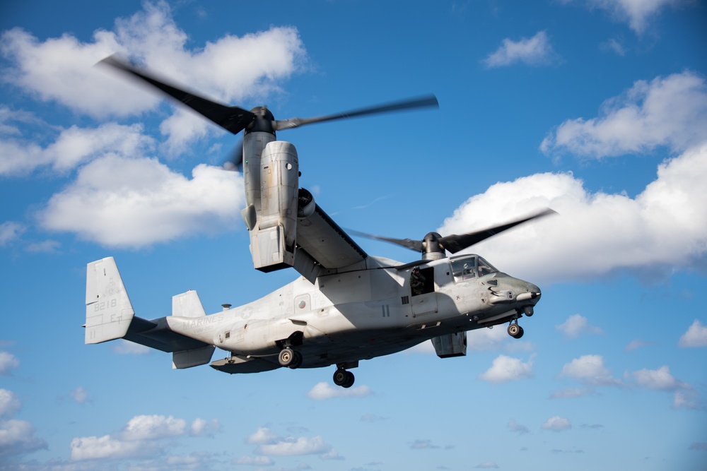 An MV-22B Osprey assigned to the 31st Marine Expeditionary Unit (MEU) lands on the flight deck of the forward-deployed amphibious assault ship USS America (LHA 6)