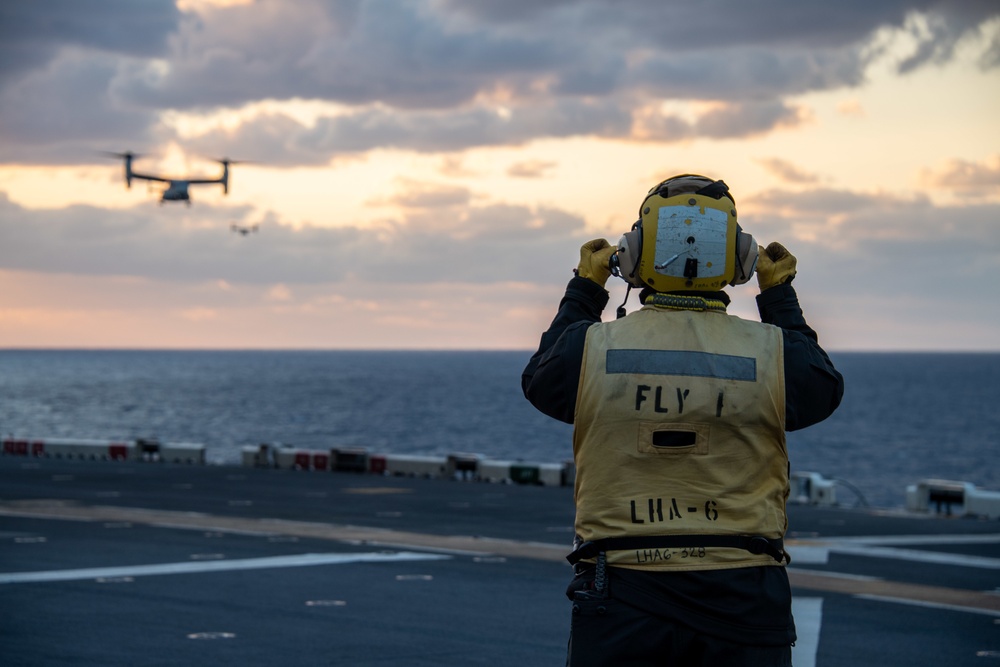 Sailor conducts flight deck operations