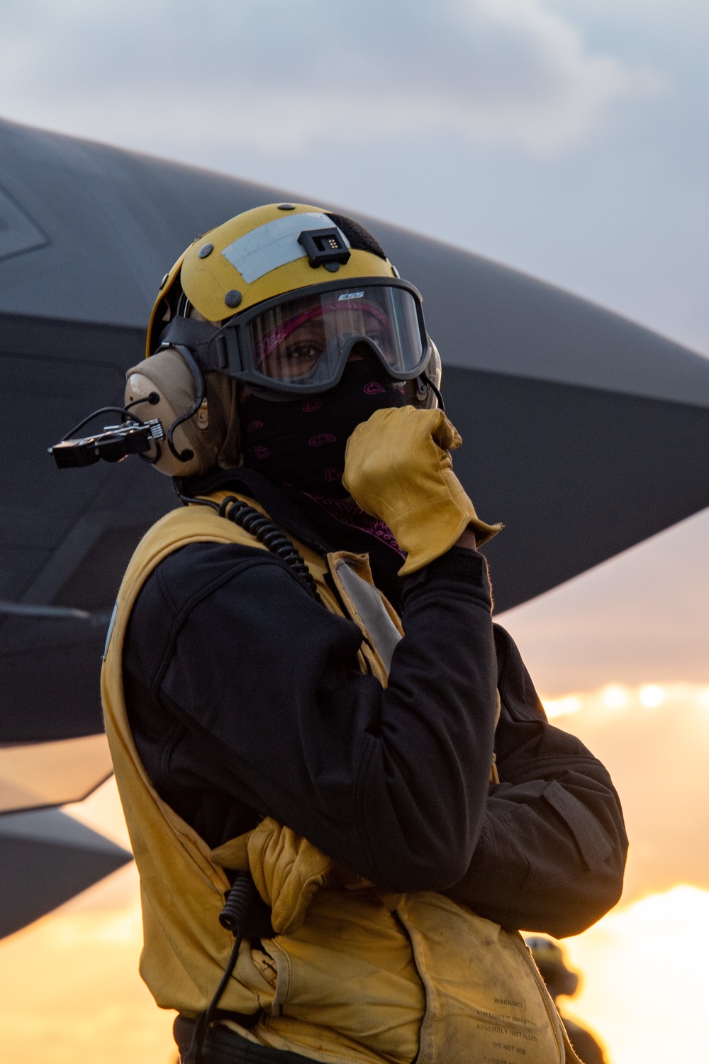 Sailor conducts flight deck operations