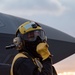 Sailor conducts flight deck operations