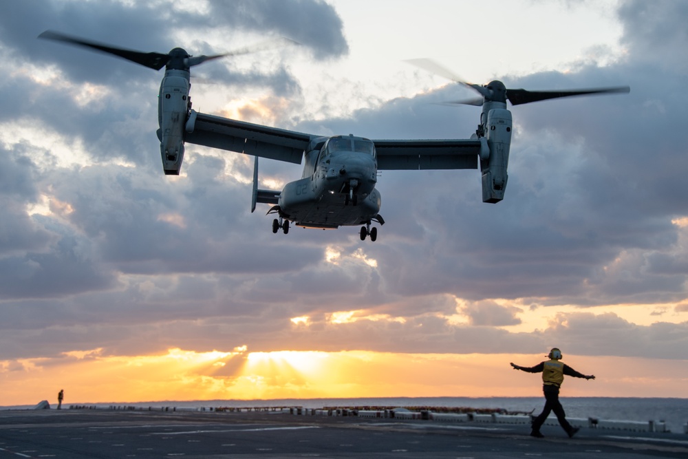 An MV-22B Osprey assigned to the 31st Marine Expeditionary Unit (MEU) lands on the flight deck of the forward-deployed amphibious assault ship USS America (LHA 6)