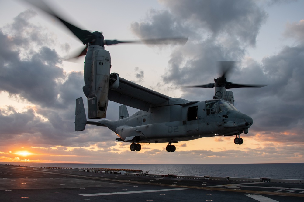 An MV-22B Osprey assigned to the 31st Marine Expeditionary Unit (MEU) lands on the flight deck of the forward-deployed amphibious assault ship USS America (LHA 6)