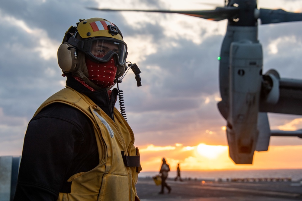 Sailor conducts flight deck operations