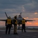 Sailors assigned to the forward-deployed amphibious assault ship USS America (LHA 6) conduct flight operations