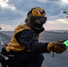 Sailor conducts flight deck operations