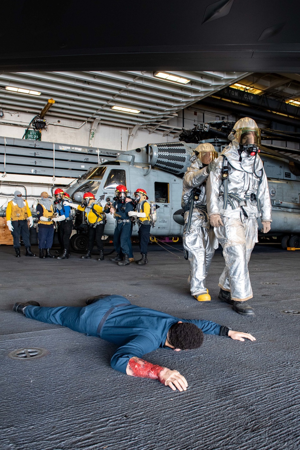 Sailors simulate a rescue scenario