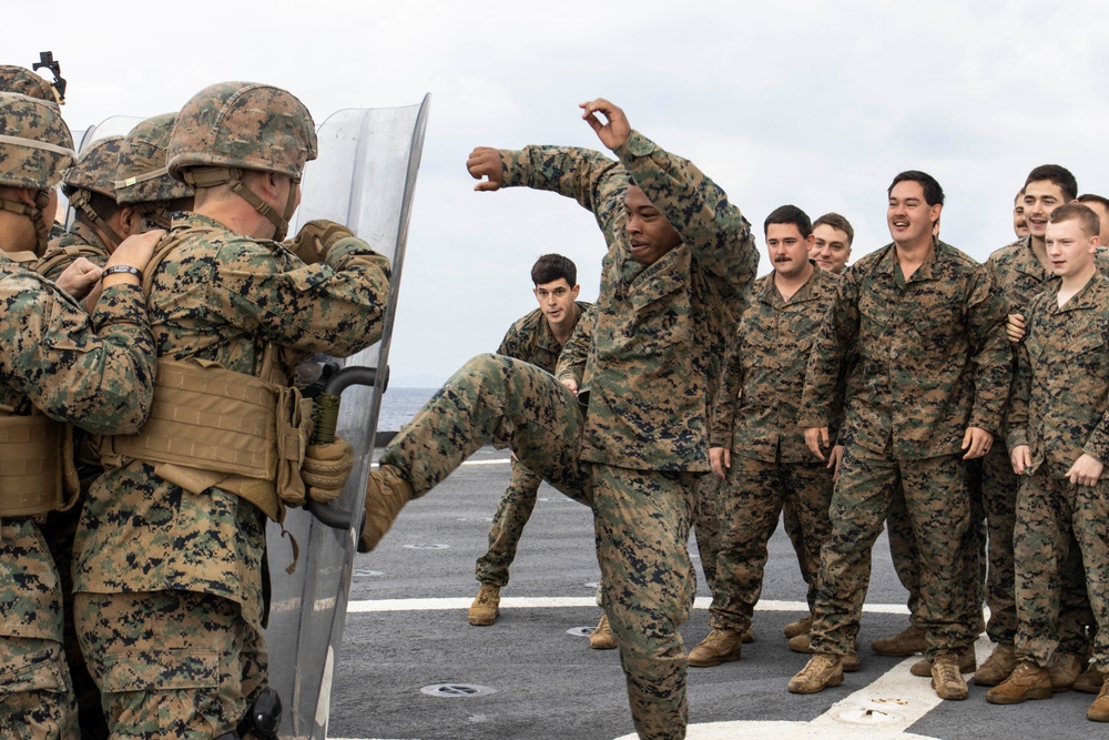 BLT 3/4 practices riot control on the flight deck