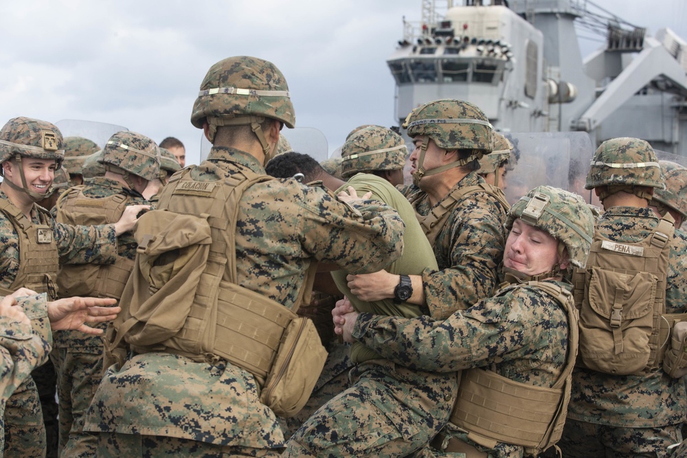 BLT 3/4 practices riot control on the flight deck