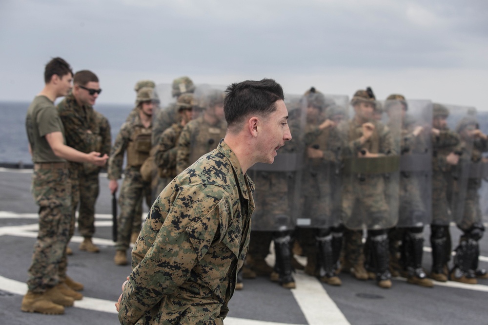 BLT 3/4 practices riot control on the flight deck