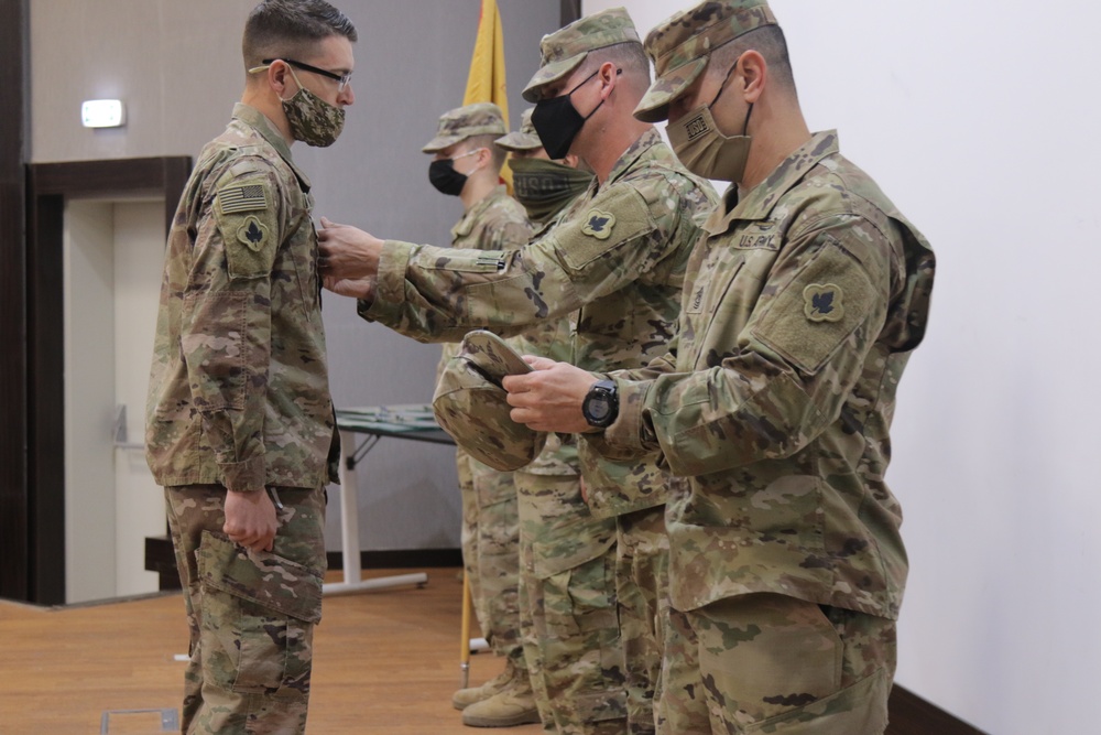 Sergeant Major Young promotes Sergeant Nowak to Staff Sergeant