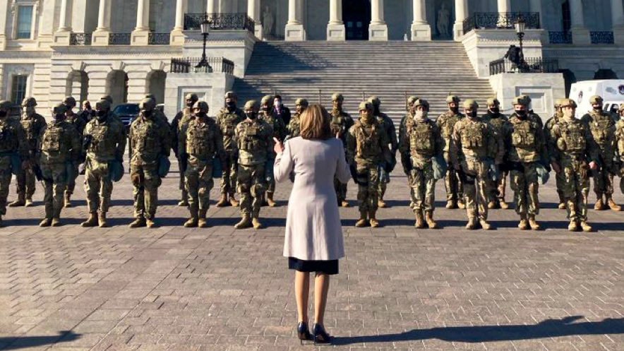 Speaker Nancy Pelosi speaks with NY National Guard Airmen