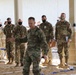 Colonel briefing at a JRTC Task Force pre 21-04-rotational while standing in an outdoor sand table.