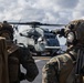 Marines aboard USS America load onto a CH-53