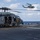 Marines aboard USS America load onto a CH-53