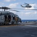 Marines aboard USS America load onto a CH-53