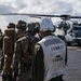 Marines aboard USS America load onto a CH-53