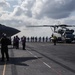 Marines aboard USS America load onto a CH-53