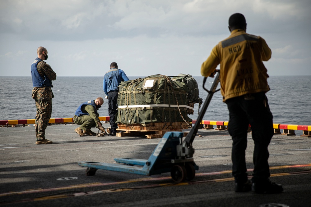 Riggers and Recon Marines jump over Ie Shima