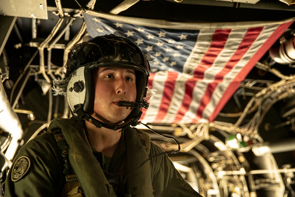 Riggers and Recon Marines jump over Ie Shima