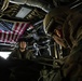 Riggers and Recon Marines jump over Ie Shima
