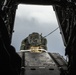Riggers and Recon Marines jump over Ie Shima