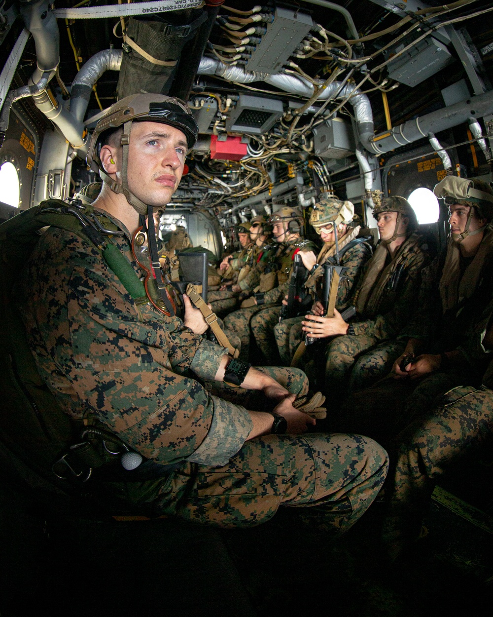 Riggers and Recon Marines jump over Ie Shima