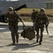 Riggers and Recon Marines jump over Ie Shima