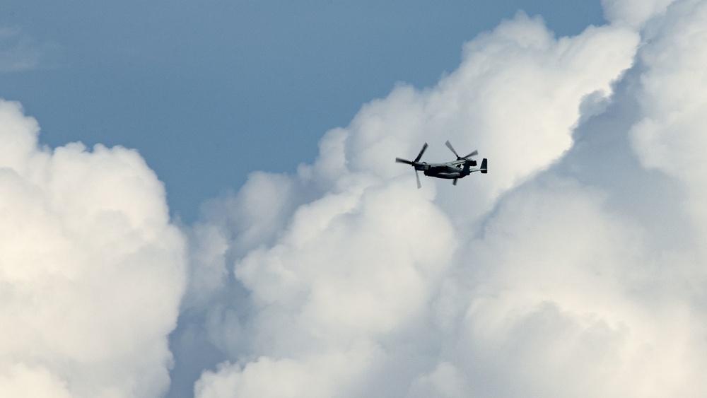 Riggers and Recon Marines jump over Ie Shima