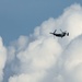 Riggers and Recon Marines jump over Ie Shima