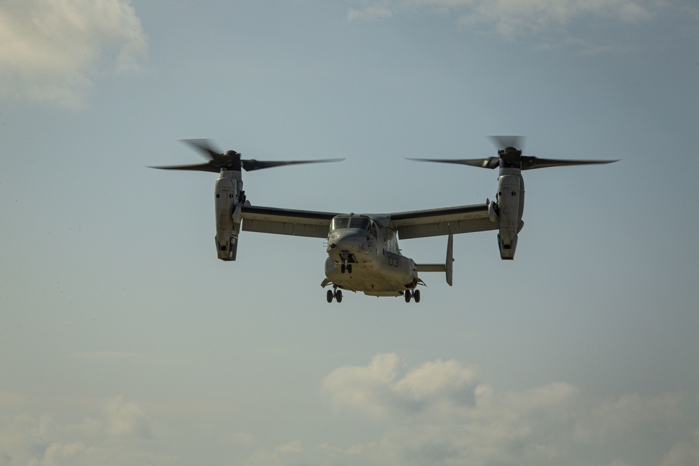 Riggers and Recon Marines jump over Ie Shima