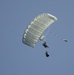 Riggers and Recon Marines jump over Ie Shima