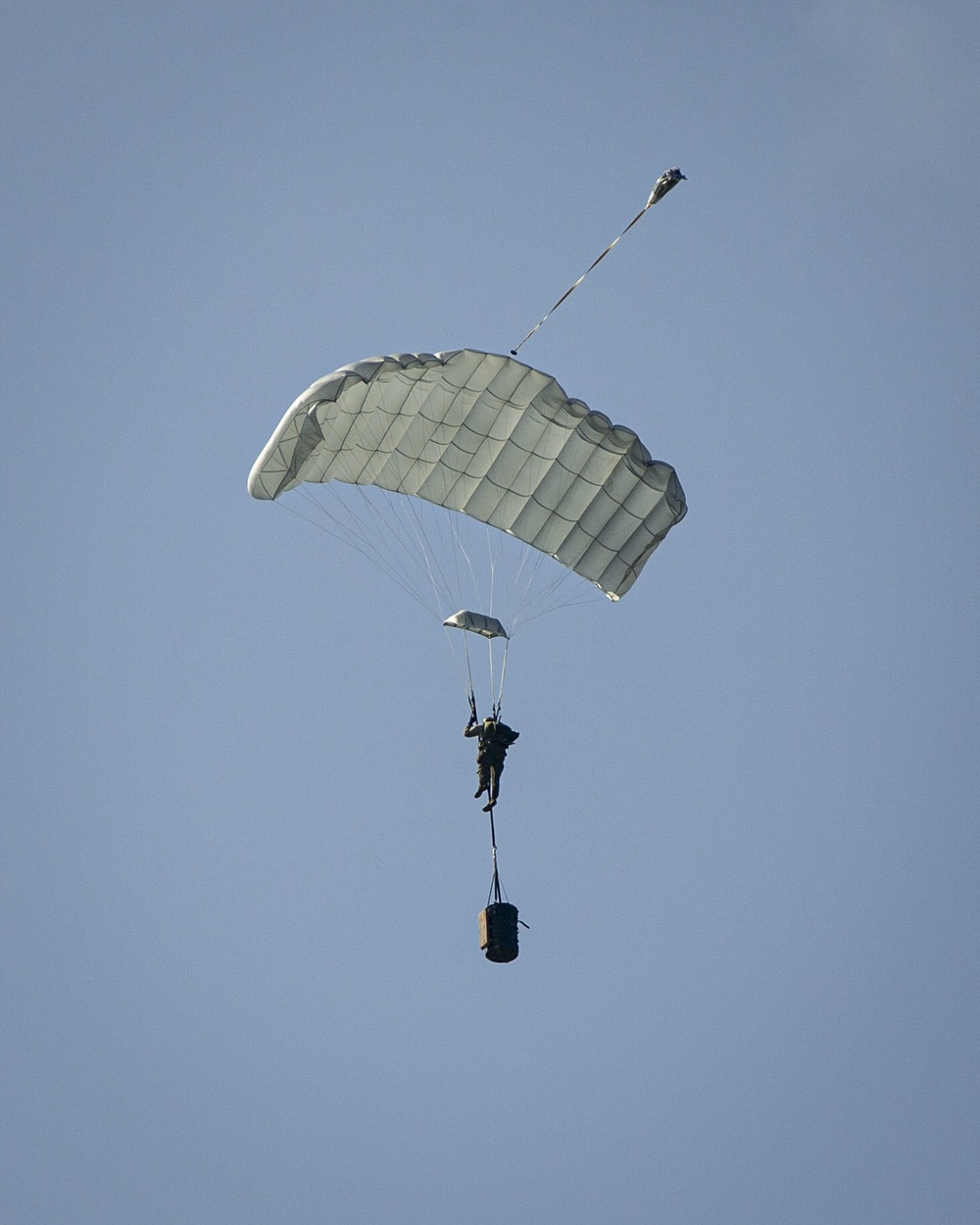Riggers and Recon Marines jump over Ie Shima