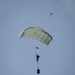 Riggers and Recon Marines jump over Ie Shima