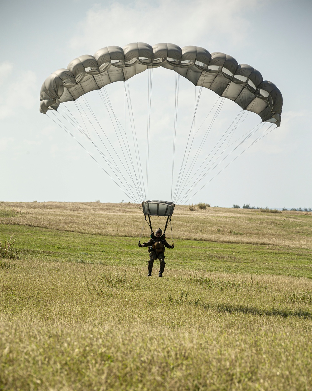 Riggers and Recon Marines jump over Ie Shima