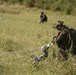 Riggers and Recon Marines jump over Ie Shima