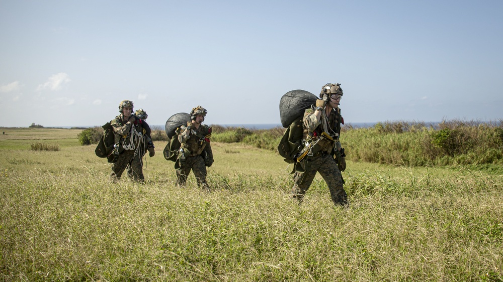 Riggers and Recon Marines jump over Ie Shima
